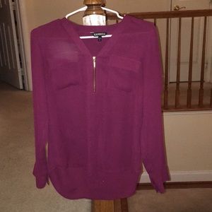 Maroon blouse with gold zipper and two pockets